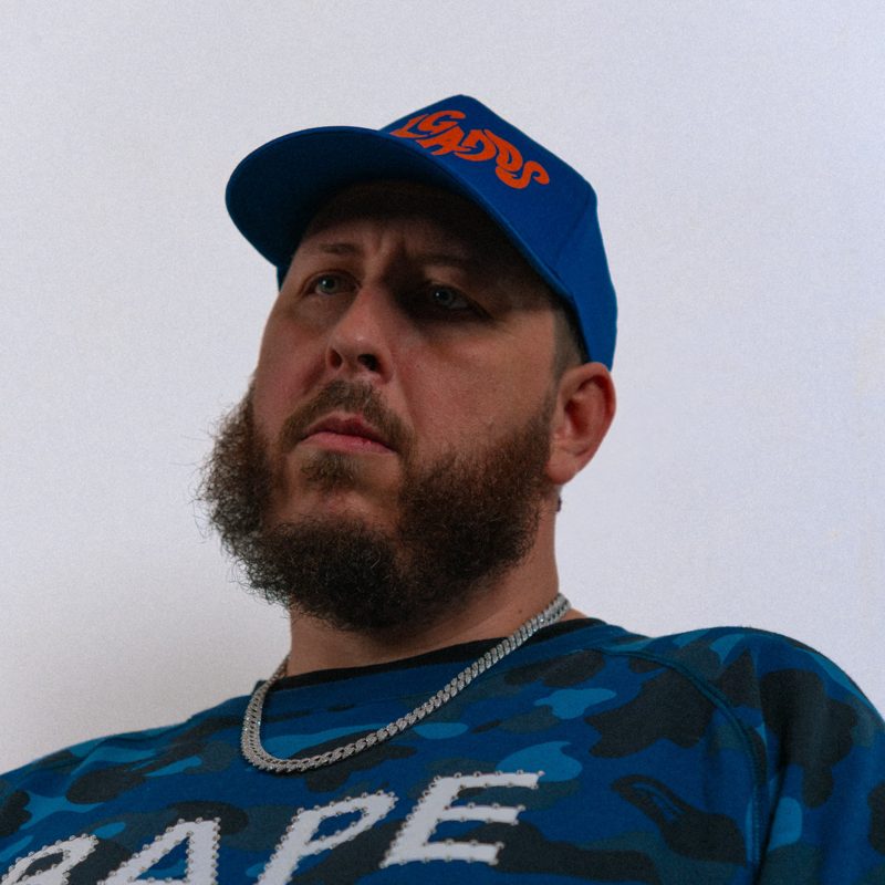 Fenix seen from below in a royal blue cap and blue camo